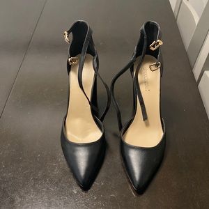 Black pumps with 2 buckles.